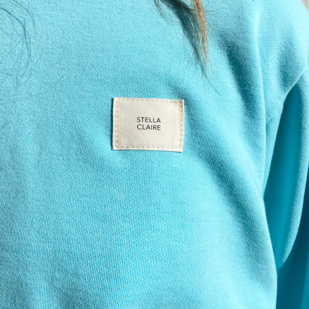 Stella Claire soft cotton crewneck sweatshirt with ‘Be Kind’ embroidered on the wrist ribbing. New Zealand made.